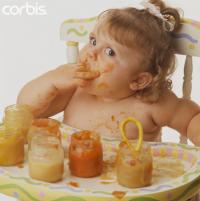 Messy Baby Feeding Herself --- Image by  Here's Looking at You/Brand X/Corbis